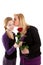 Young girl gives rose to mother