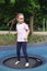 young girl in glasses goes in for sports on the playground. rest and childhood outdoors