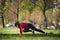 Young girl goes in for sports in the park in a medical mask and gloves after quarantine