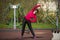 Young girl goes in for sports wearing a medical mask and gloves after the end of the coronovirus pandemic