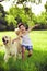 Young girl with golden retriever running