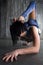 Young girl gymnast making extremely flexible tricks