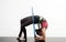 Young girl with gymnastics ring on white background.