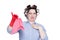 Young girl in hair curlers emotionally frowns from smelly rags, isolated on white background.