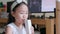 A young girl is happily drinking a white color carton of milk. Asian girl sitting on the table drinking milk. Slow-motion 4k handh