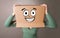 Young girl with happy cardboard box face