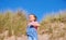 Young Girl Having Fun On Beach Vacation Running Down Sand Dunes