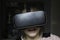 Young girl having fun at home with VR headset