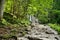 Young girl heading to Siklawica Waterfall in Strazyska Valley in Tatra Mountain range, Poland