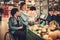 Young girl helping her disabled mothter in wheelchair in a grocery store