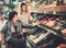 Young girl helping her disabled mothter in wheelchair in a grocery store