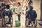 Young girl helping two disabled women in wheelchair in a department store