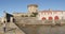 young girl with her camera visiting Ciboure in the Basque Country with the famous fort of Socoa