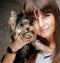 Young girl with her Yorkie puppy