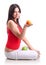 Young girl hold apple and orange. Isolated