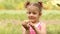 Young girl holding chicken