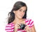 Young girl holding a compact camera with her hair floating in th