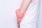 Young girl holding her elbow joint, pain and inflammation in the elbow, white background, close-up, medical, copy space