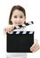 Young girl holding a movie clapper