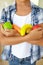 Young girl holding plastic fruit and vegetables