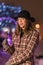 Young girl holding sparklers for christmas during winter alone i