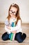 Young girl holding teddy bear