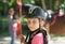 Young girl in horseback rider helmet