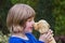 Young girl hugging stuffed dog