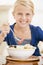 Young girl indoors eating seafood