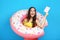 Young girl with inflatable donut