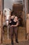 Young girl inspects an injured horseÂ´s mouth