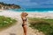 Young girl invites you to the Caribbean beautiful wild beach