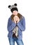 Young girl with jacket and wooly hat holding cup