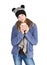 Young girl with jacket and wooly hat holding cup
