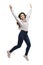 A young girl in jeans and a white shirt is jumping. Smiling brunette with long hair. Movement and energy. Isolated on a white