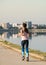 Young girl jogging in the morning. Woman working out on Lacul Morii or Windmill lake in Bucharest
