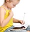 Young girl kid sitting reading learning drawing on digital tablet touch screen pad with pencil