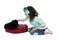 Young girl kneeling down petting her black lab puppy