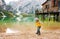 Young girl on Lake Bries in the autumn skipping stones