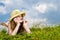 Young girl laying in meadow