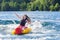 Young girl lets go of inflatable while tubing
