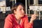 Young Girl Licking Straw From Her Coffee Cup and Enjoying Beautiful Sunny Day Outside