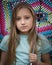 Young Girl With Long Hair Holding an Umbrella