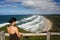 Young girl is looking at beautiful coastline