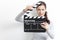 Young girl looking through clapper board