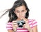 Young girl looking at images taken on a compact camera