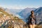 Young girl looking at the panoramic scenery at Monte Bre, Lugano, Switzerland