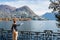 Young girl looking and pointing at the panoramic scenery. Lugano, Switzerland