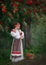 A young girl looks at a basket filled with Rowan bunches