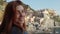 Young girl looks at the landscape in Manarola, city of the Five Lands